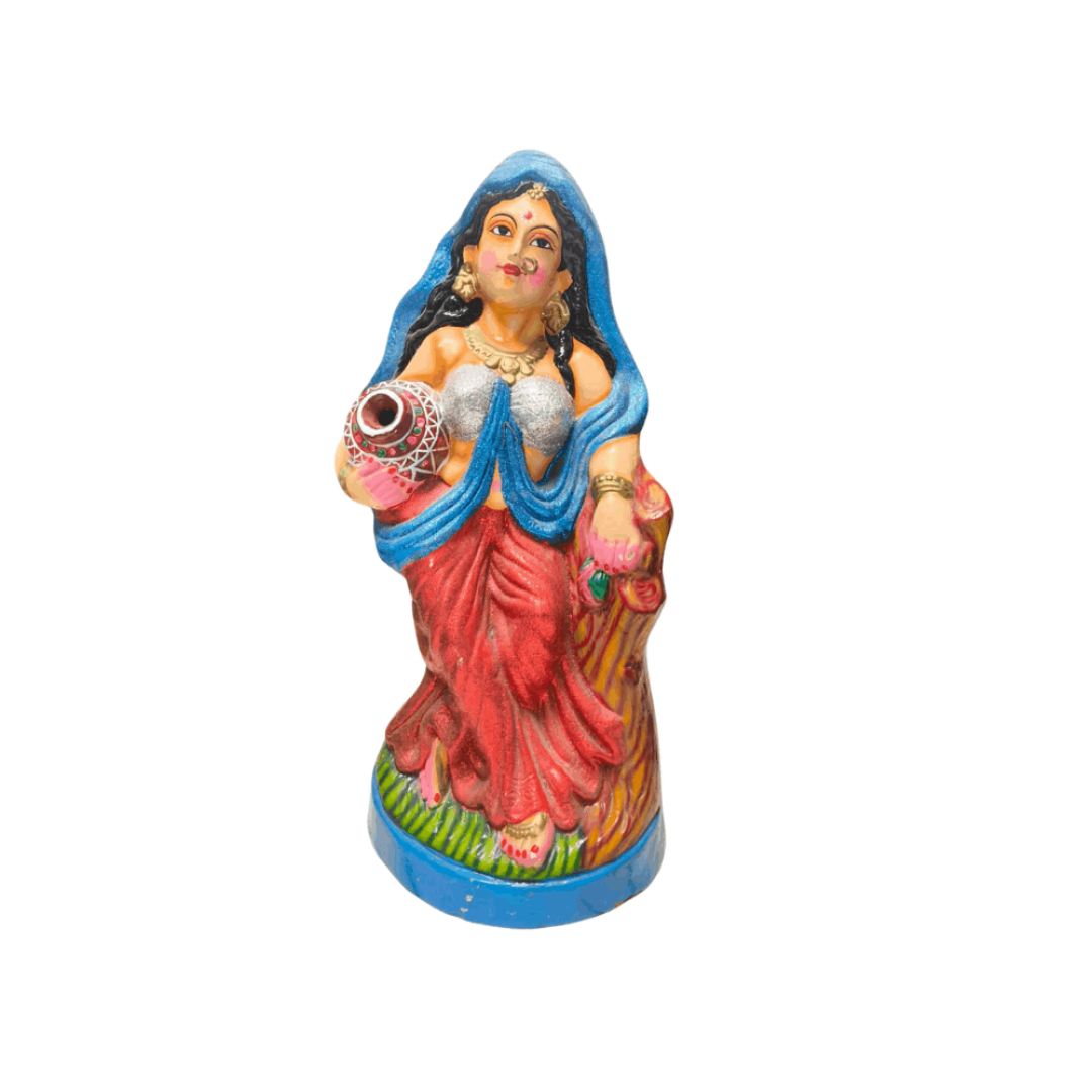 Colorful painted Statue of an Indian village woman carrying a water pot